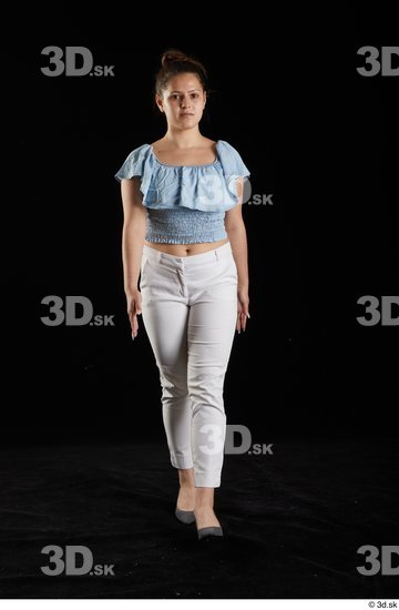 Serina Gomez  blue carmen shirt casual dressed front view grey high heels walking white trousers whole body  jpg