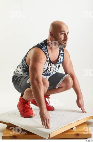 Neeo  blue shorts dressed kneeling orange sneakers sports tank top whole body  jpg