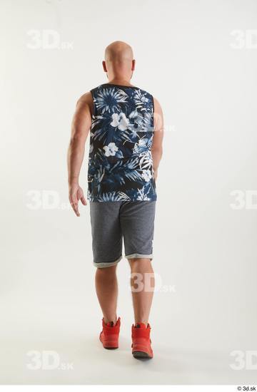 Neeo  back view blue shorts dressed orange sneakers sports tank top walking whole body  jpg
