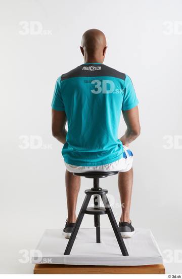 Whole Body Man Black Sports Shirt Shorts Slim Sitting Studio photo references