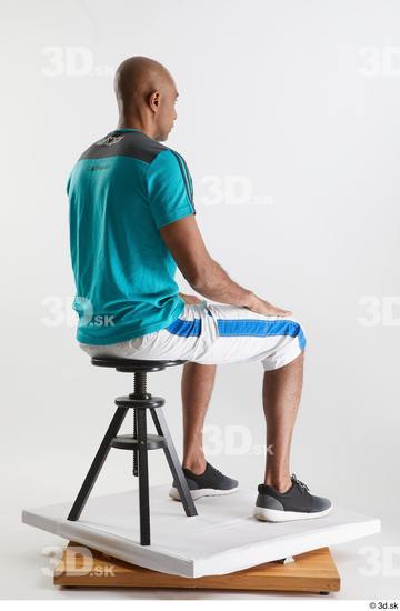 Whole Body Man Black Sports Shirt Shorts Slim Sitting Studio photo references