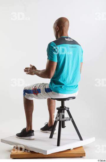 Whole Body Man Black Sports Shirt Shorts Slim Sitting Studio photo references