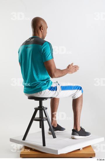 Whole Body Man Black Sports Shirt Shorts Slim Sitting Studio photo references