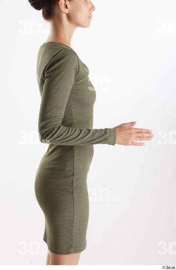 Vanessa Angel  arm casual dressed flexing green long sleeve dress side view  jpg