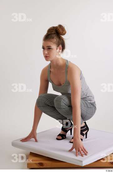 Olivia Sparkle  black high heels sandals casual dressed grey checkered trousers grey tank top kneeling whole body  jpg