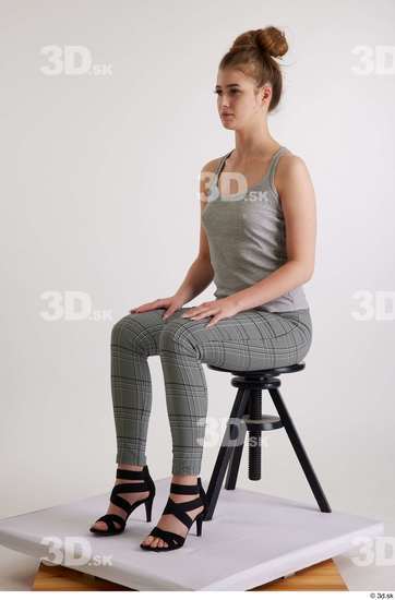 Olivia Sparkle  black high heels sandals casual dressed grey checkered trousers grey tank top sitting whole body  jpg