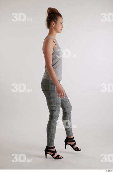 Olivia Sparkle  black high heels sandals casual dressed grey checkered trousers grey tank top side view whole body  jpg