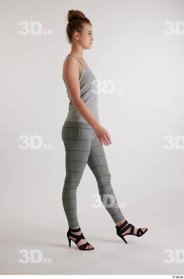 Olivia Sparkle  black high heels sandals casual dressed grey checkered trousers grey tank top side view whole body  jpg