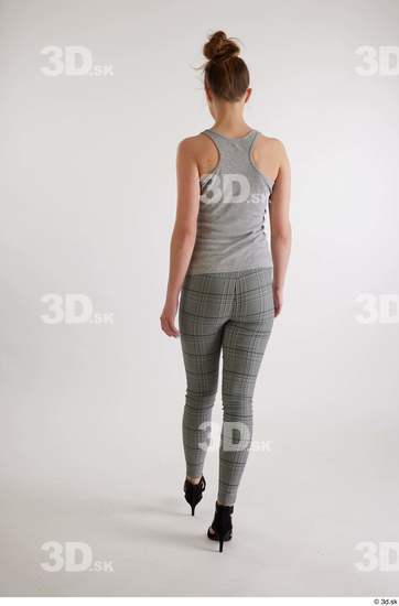 Olivia Sparkle  back view black high heels sandals casual dressed grey checkered trousers grey tank top whole body  jpg