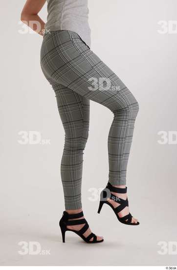 Olivia Sparkle  black high heels sandals casual dressed flexing grey checkered trousers leg side view  jpg