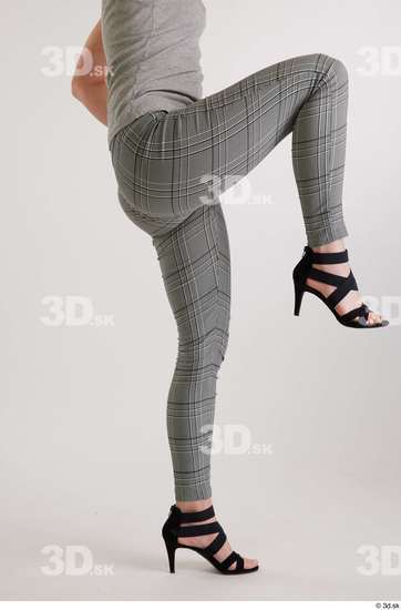 Olivia Sparkle  black high heels sandals casual dressed flexing grey checkered trousers leg side view  jpg