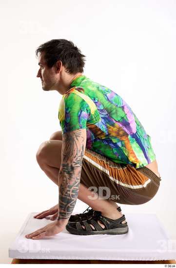 Whole Body Man White Casual Shorts Average Parrot Kneeling Studio photo references