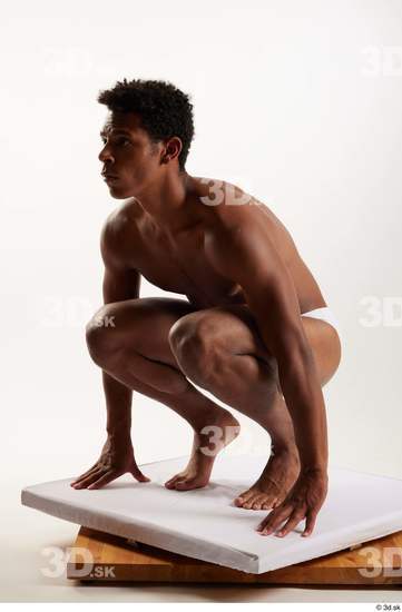 Whole Body Man Black Swimsuit Athletic Kneeling Studio photo references