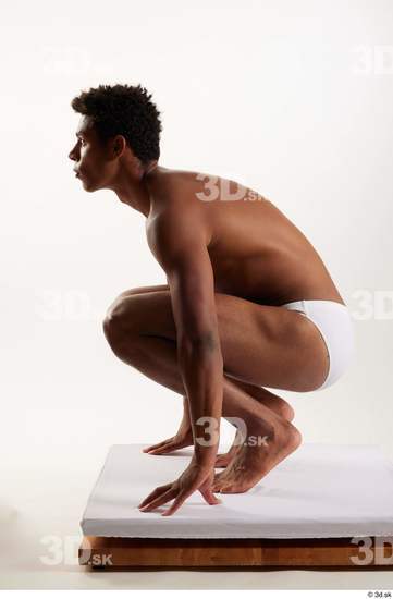 Whole Body Man Black Swimsuit Athletic Kneeling Studio photo references