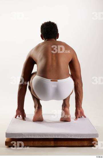 Whole Body Man Black Swimsuit Athletic Kneeling Studio photo references