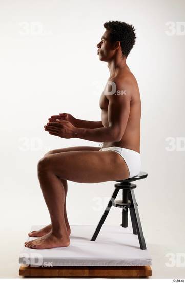 Whole Body Man Black Swimsuit Athletic Sitting Studio photo references