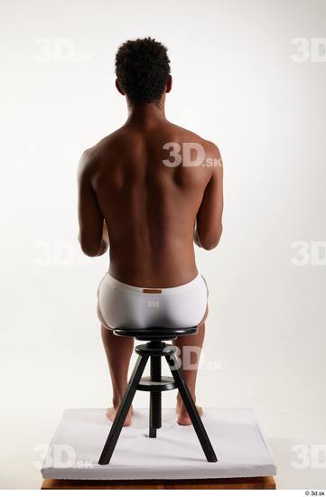 Whole Body Man Black Swimsuit Athletic Sitting Studio photo references