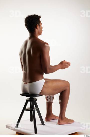 Whole Body Man Black Swimsuit Athletic Sitting Studio photo references