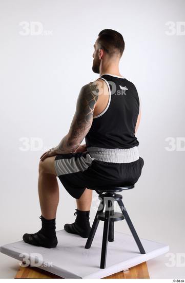 Whole Body Man White Sports Shorts Slim Athletic Sitting Top Studio photo references