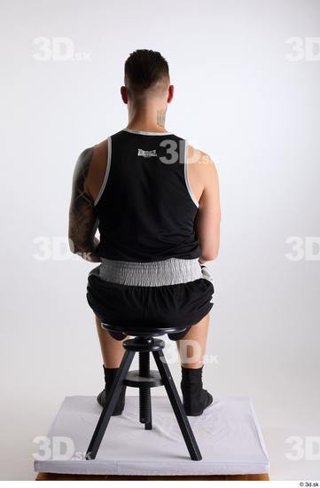 Whole Body Man White Sports Shorts Slim Athletic Sitting Top Studio photo references